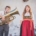 Man sieht ein Foto von Franziska Wanninger und Martin Frank, in dem beide in Tracht angzogen sind und Martin Tuba spielt.